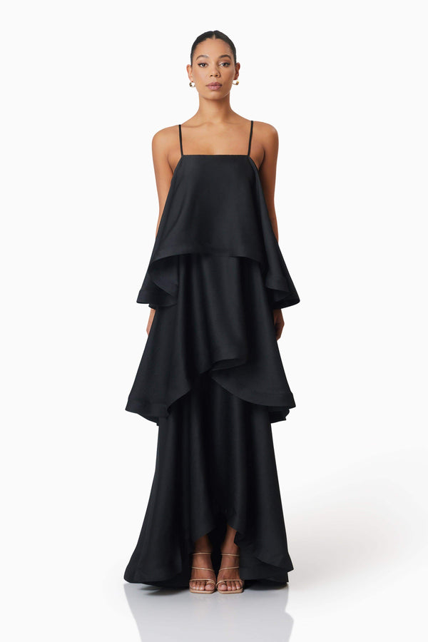 Brunette model wearing Tilly Tiered Maxi Dress in Black front shot