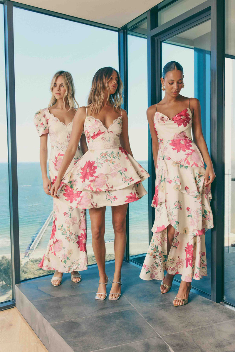 Blonde model wearing Rosalina Tiered Mini Dress in Floral campaign shot