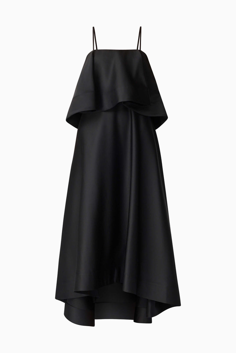 Brunette model wearing Reyna Tiered Maxi Dress in Black ghost shot