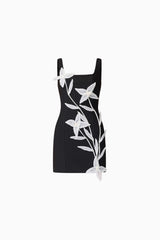 Brunette model wearing ILARIA MINI DRESS in black ghost shot