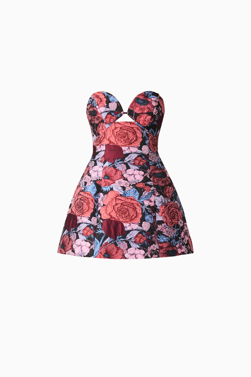 Brunette model wearing Delphine Tulip Mini Dress in Pink & Black Floral ghost shot