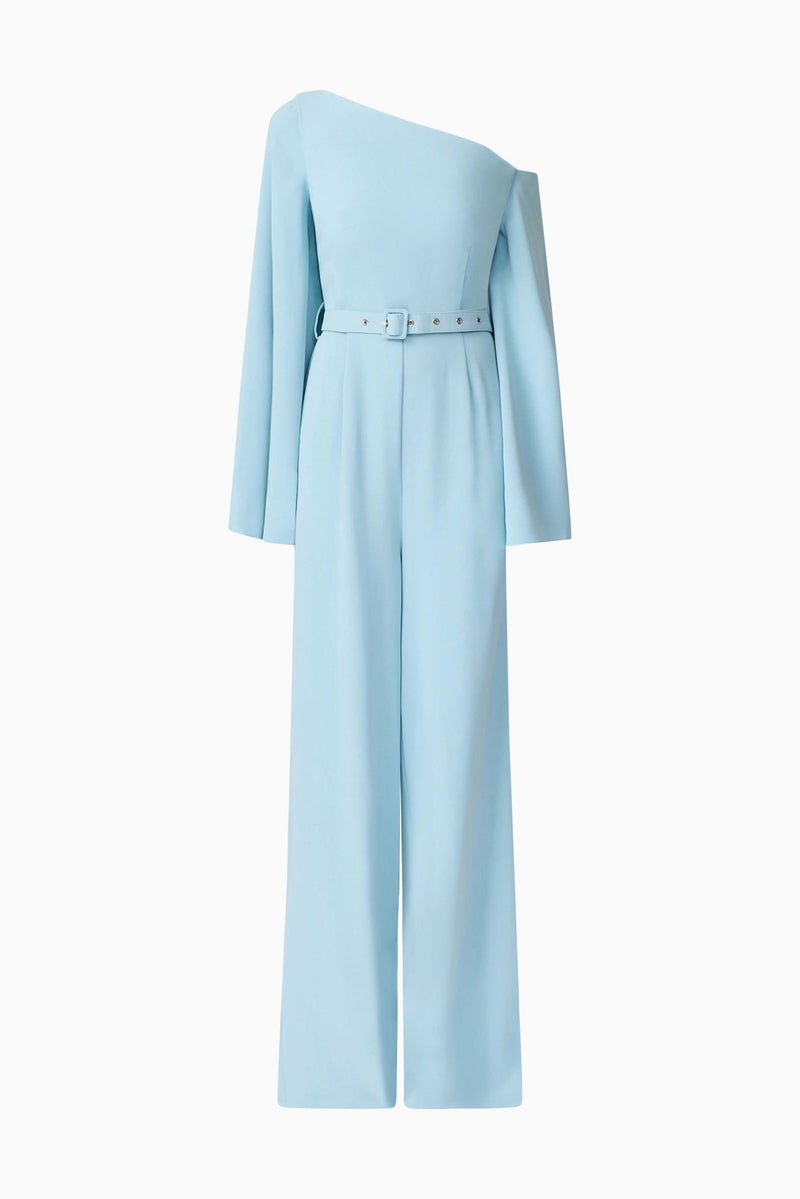 Blonde model wearing Elinor Asymmetrical Jumpsuit in Blue ghost shot