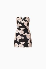 Brunette model wearing Margaux Strapless Mini Dress in Black & Gold Floral  ghost shot