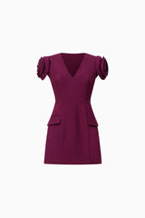 Brunette model wearing Theresa V-Neck Mini Dress in Burgundy ghost shot