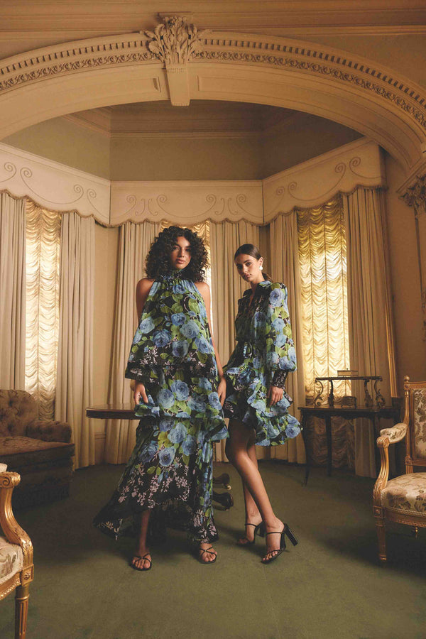 Blonde model wearing the Briony Tiered Gown in Black & Blue Floral campaign shot