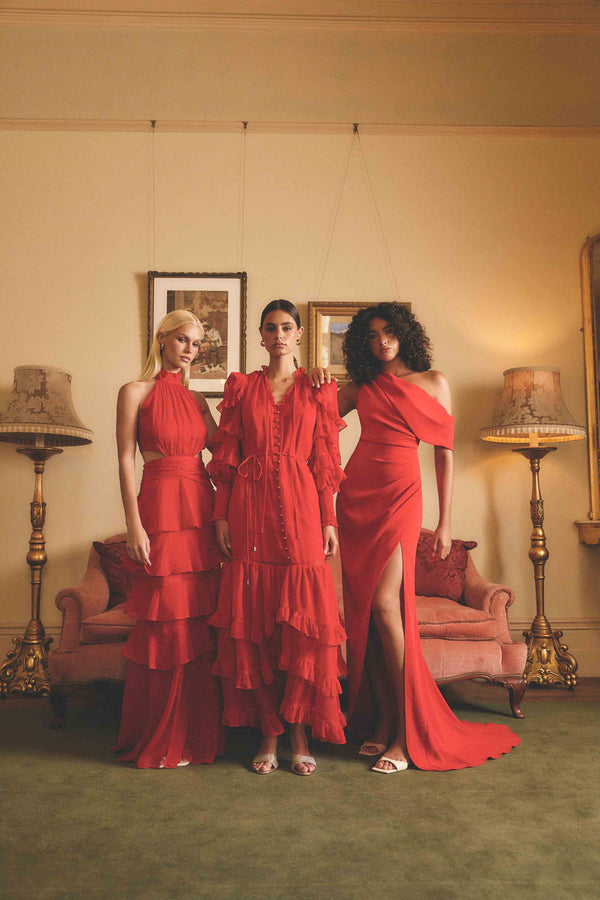 Blonde model wearing Lilja Long Sleeve Maxi Dress in Red campaign shot