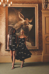 Brunette model wearing Ursula Mini Shift Dress in Black campaign shot