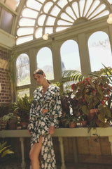 Brunette model wearing Rosey Long Sleeve Set in Black Floral campaign shot