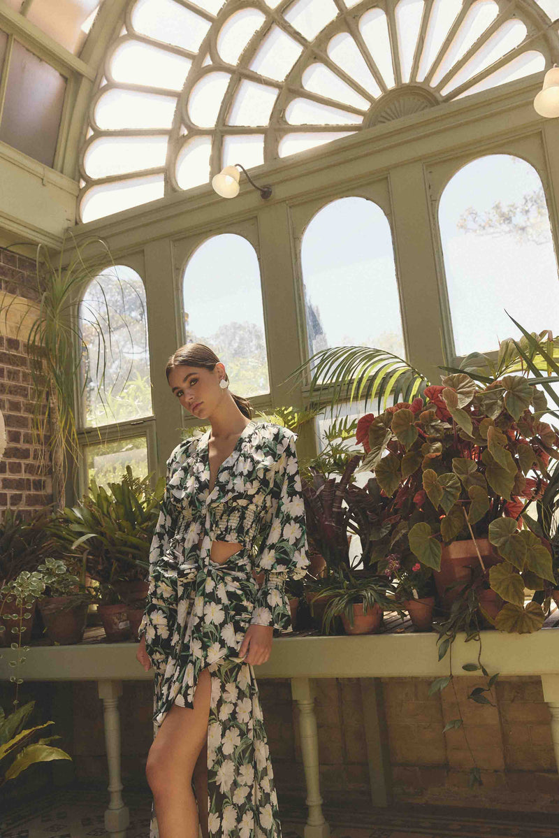 Brunette model wearing Rosey Long Sleeve Set in Black Floral campaign shot