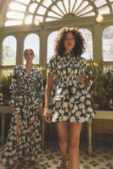 Brunette model wearing Rosey Short Sleeve Mini Dress in Black Floral campaign shot