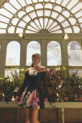 Brunette model wearing Azelie Off The Shoulder Mini Dress in Black campaign shot