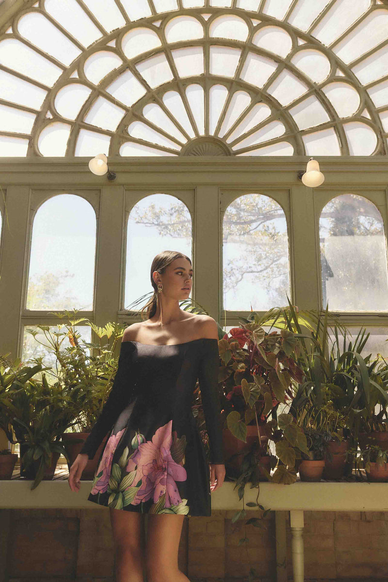 Brunette model wearing Azelie Off The Shoulder Mini Dress in Black campaign shot