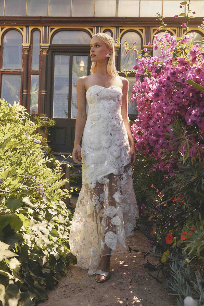 Brunette model wearing Carol Strapless Gown in White campaign shot