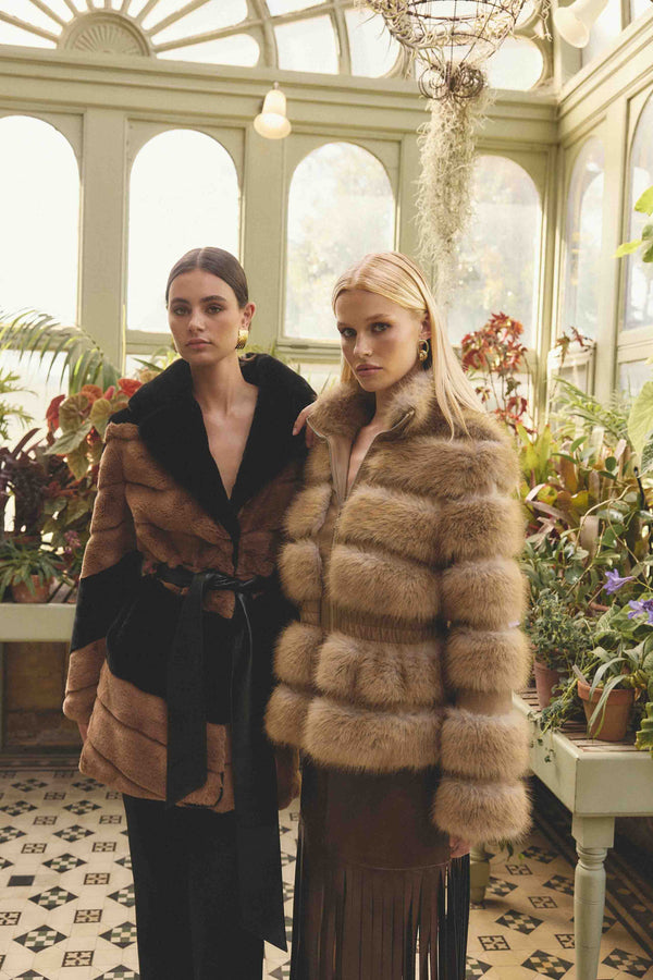 Brunette model wearing Aisling Faux Fur & Leather Jacket in Beige campaign Shot