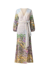 Brunette model wearing the Arden Long Sleeve Gown in Multi Ombre ghost posed shot