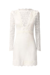 Brunette model wearing the Margot Long Sleeve Mini Dress in White ghost imagery