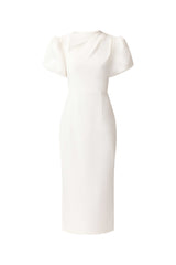 Brunette model wearing the Hester Puff Sleeve Midi Dress in White ghost shot