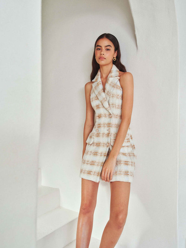 Brunette model wearing Ashlyn Halter Tweed Mini Dress in White & Gold campaign shot
