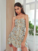 Brunette model wearing Tasmin Strapless Mini Dress in Blue & Yellow Floral front campaign shot 