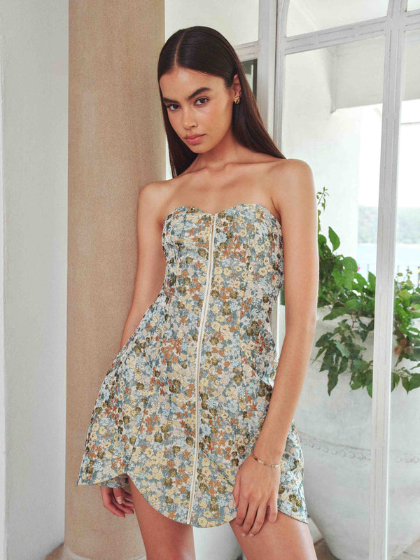 Brunette model wearing Tasmin Strapless Mini Dress in Blue & Yellow Floral front campaign shot 