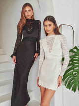 Brunette model wearing the Margot Long Sleeve Gown in Black campaign shot
