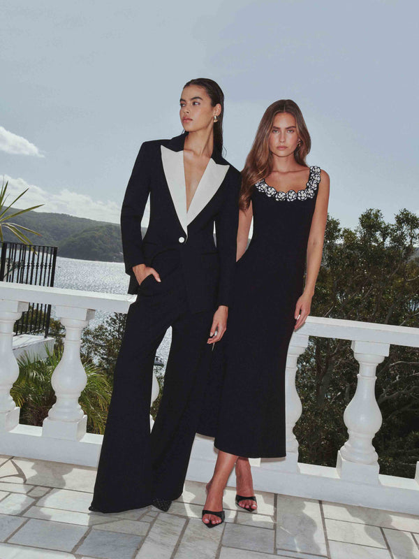 Brunette model wearing the Leonie Wide Leg Pants In Black campaign shot