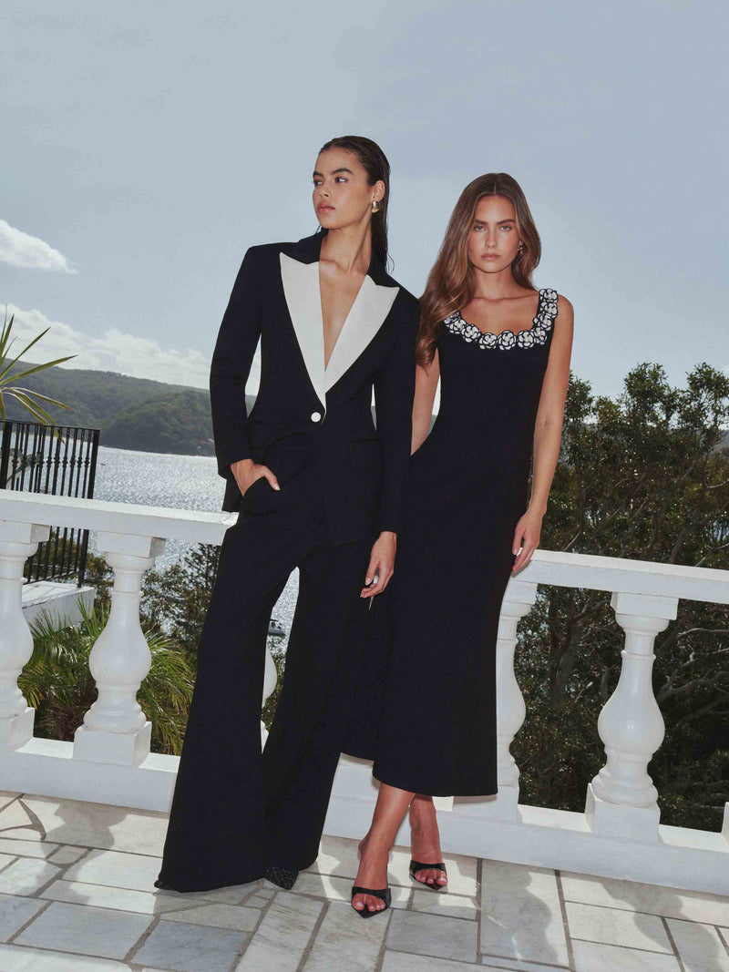 Brunette model wearing the Leonie Wide Leg Pants In Black campaign shot