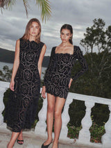 Brunette model wearing Eris Long Sleeve Mini Dress in Black campaign shot 