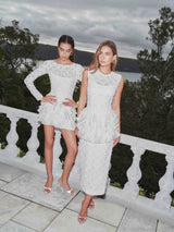 Brunette model wearing Athena Lace Midi Dress in White campaign shot 