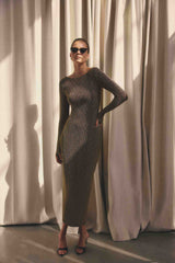 Blonde model wearing CURAAE Emery Long Sleeve Maxi Dress in Gold campaign shot