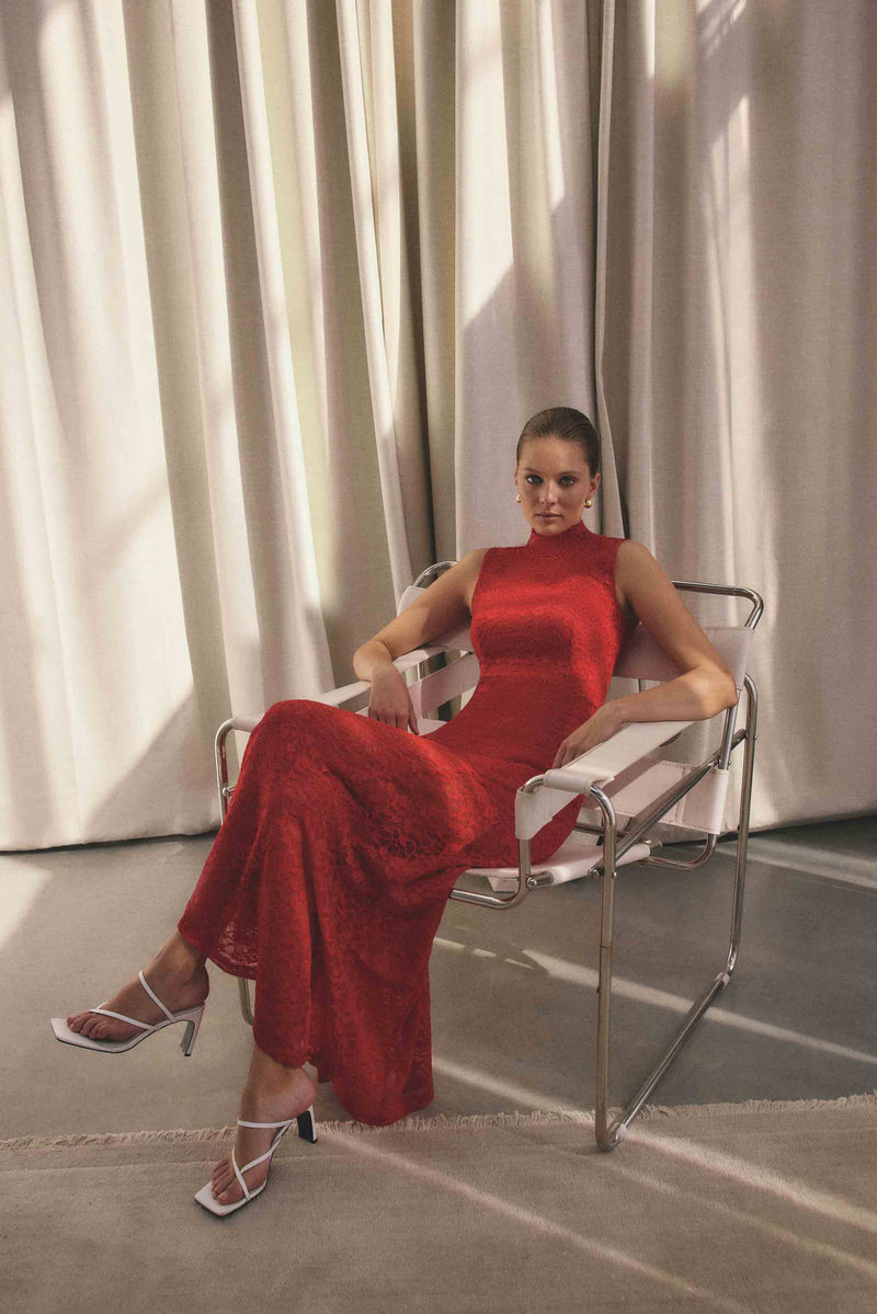 Blonde model wearing CURAAE Ariella Maxi Dress in Red campaign shot