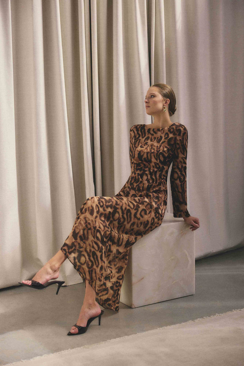 Blonde Model wearing CURAAE Zali Long Sleeve Maxi Dress in Leopard Print campaign shot