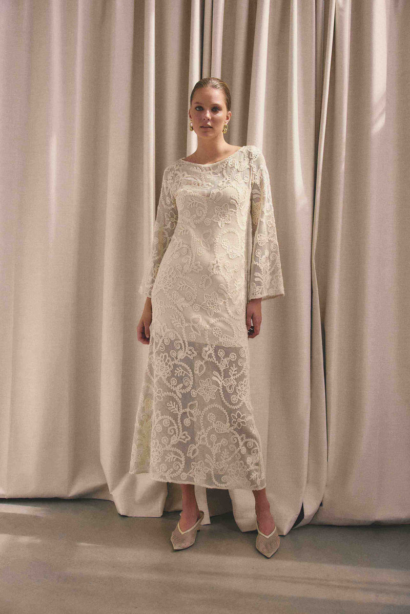 Brunette model wearing Valentine Long Sleeve Maxi Dress in Beige campaign shot