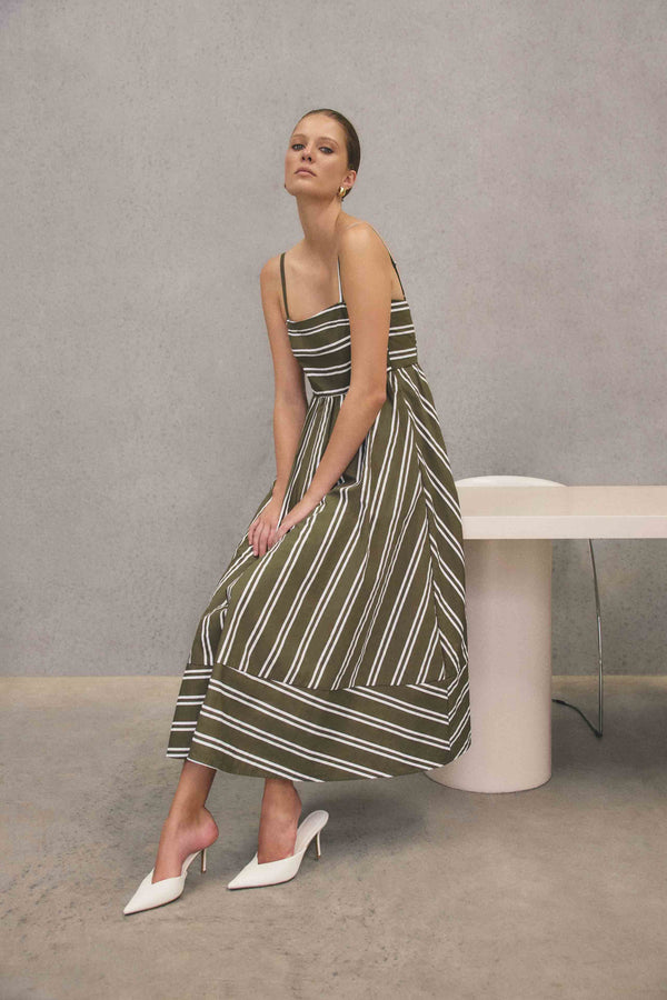 Brunette model wearing Giverny Midi Dress in Green campaign shot