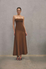 Blonde model wearing CURAAE Zahara Strapless Maxi Dress in Brown campaign shot