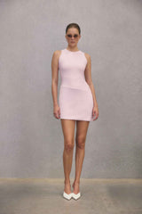 Blonde model wearing CURAAE Zahara Mini Dress in Pink campaign shot