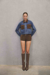 Brunette model wearing CURAAE Rhea Denim Jacket & Skirt Set campaign pose