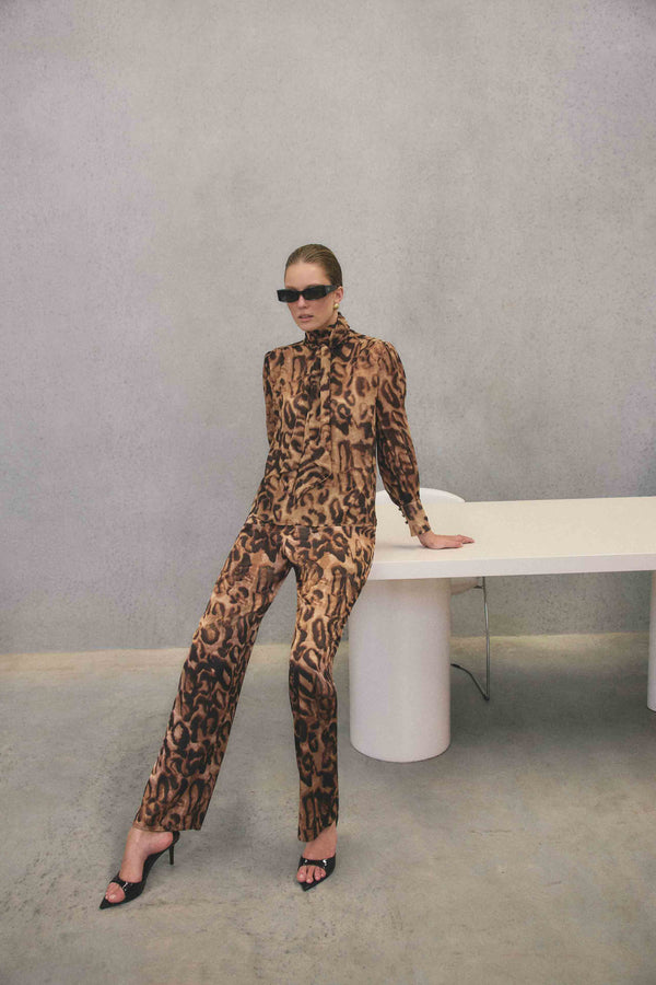 Blonde model wearing CURAAE Zahara Mini Dress in Pink campaign shot 