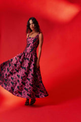 Brunette model wearing the Holly A-Line Gown in Pink & Black Floral ghost shot