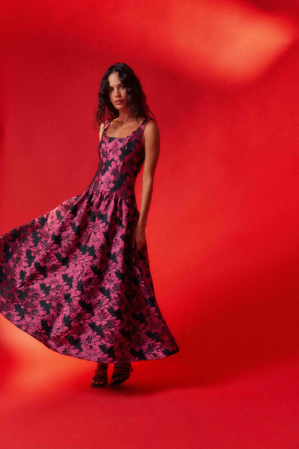 Brunette model wearing the Holly A-Line Gown in Pink & Black Floral ghost shot