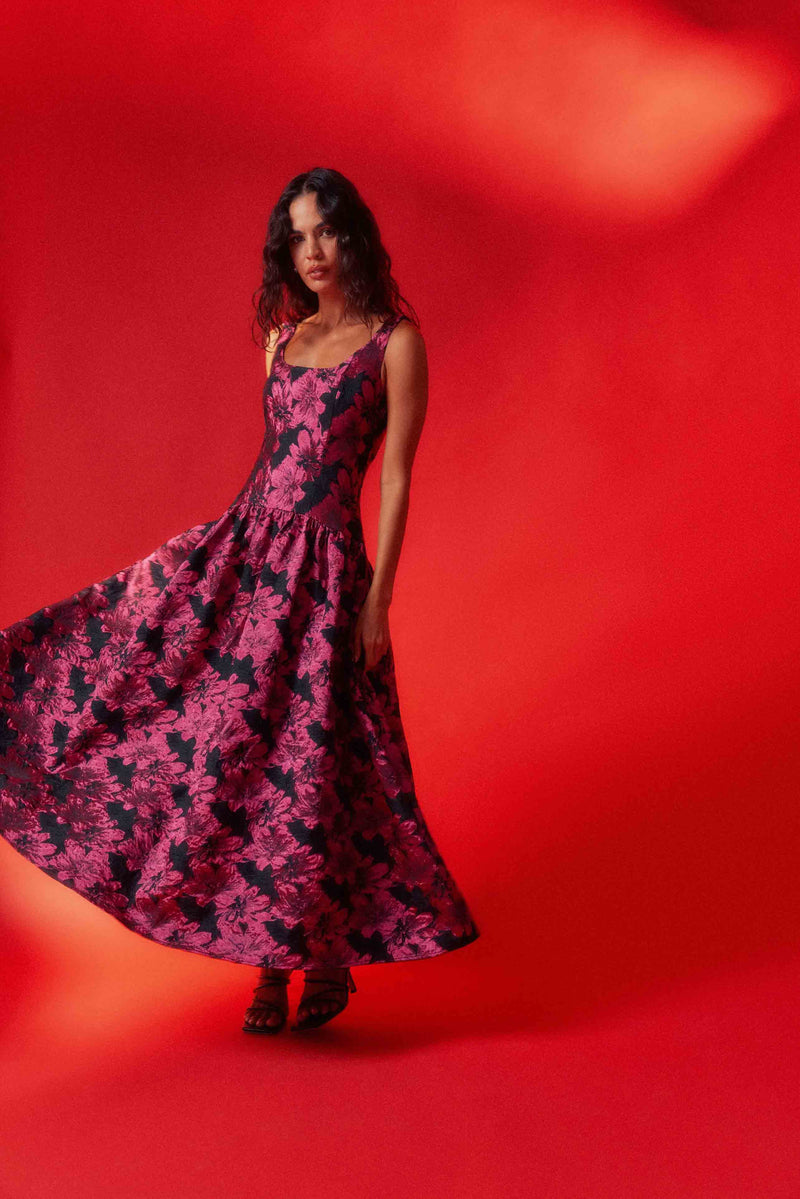 Brunette model wearing the Holly A-Line Gown in Pink & Black Floral ghost shot
