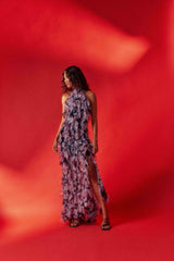 Brunette model wearing Solene Halter Gown in Purple Floral campaign shot