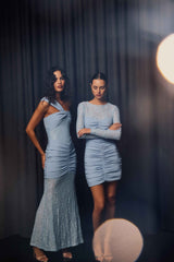 Brunette model wearing the Valencia Lace Gown in Blue ghost shot