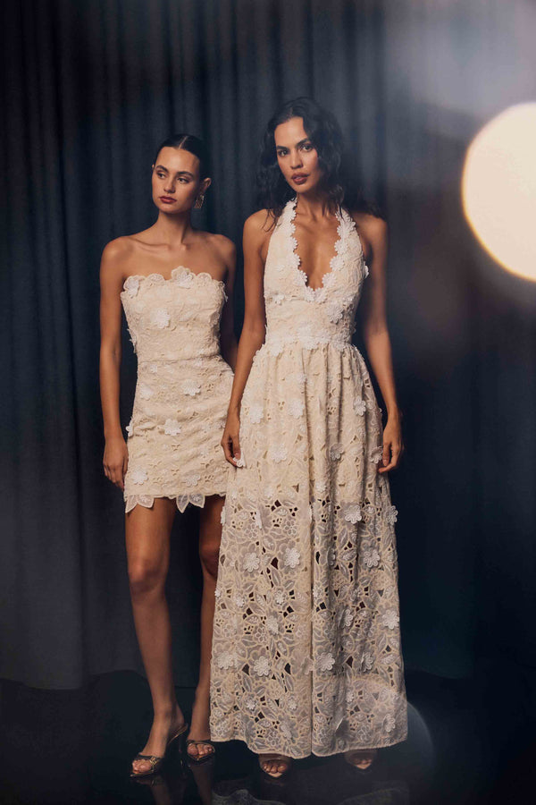 Brunette model wearing the Sienna V-Neck Gown in Cream campaign shot