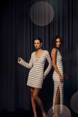 Brunette model wearing the Eldora Long Sleeve Mini Dress in Black & White campaign shot