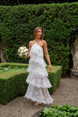 Brunette model wearing the Evelin Lace Gown in White campaign shot 