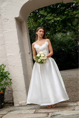 Brunette model wearing the Tula Gown in White campaign shot