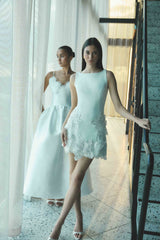 Brunette model wearing the Tula Shift Mini Dress in White campaign shot