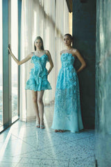 Brunette model wearing the Faye Mini Dress in Blue front shot 