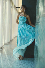 Brunette model wearing the Faye Strapless Gown in Blue campaign chat 